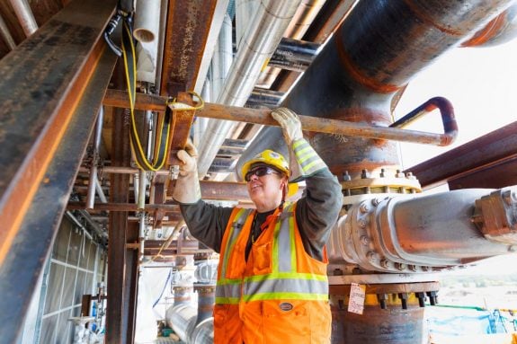 woman working on pipe